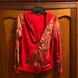 Red sweatshirt with designs and hood